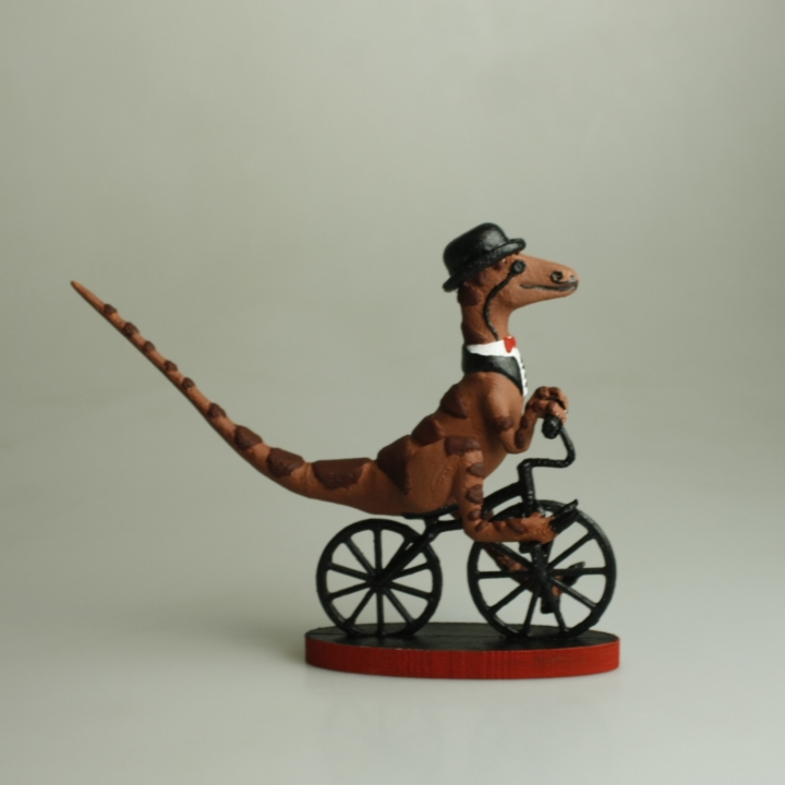 Gentleman Raptor Riding a Bike