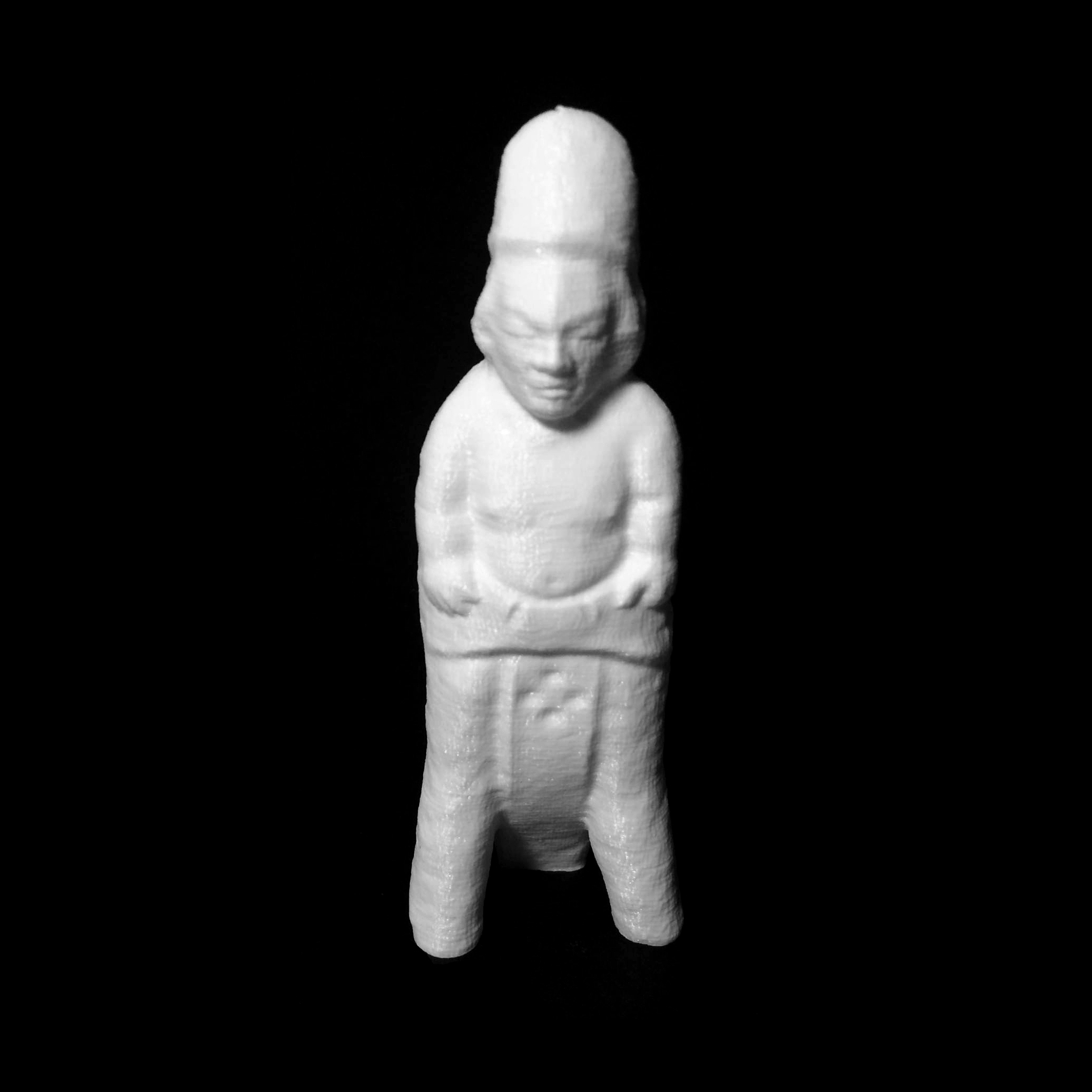 Pottery figurine of a priest