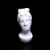 Marble head of a young woman from a funerary statue image