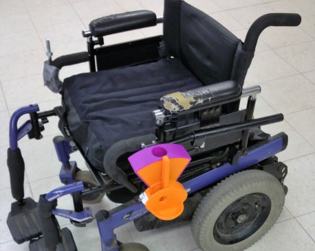 Wheelchair-Mounted Dog Treat Dispenser
