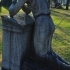 Woman crying on a tomb image