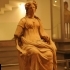 A Female Statue in a Reddish Terracotta image