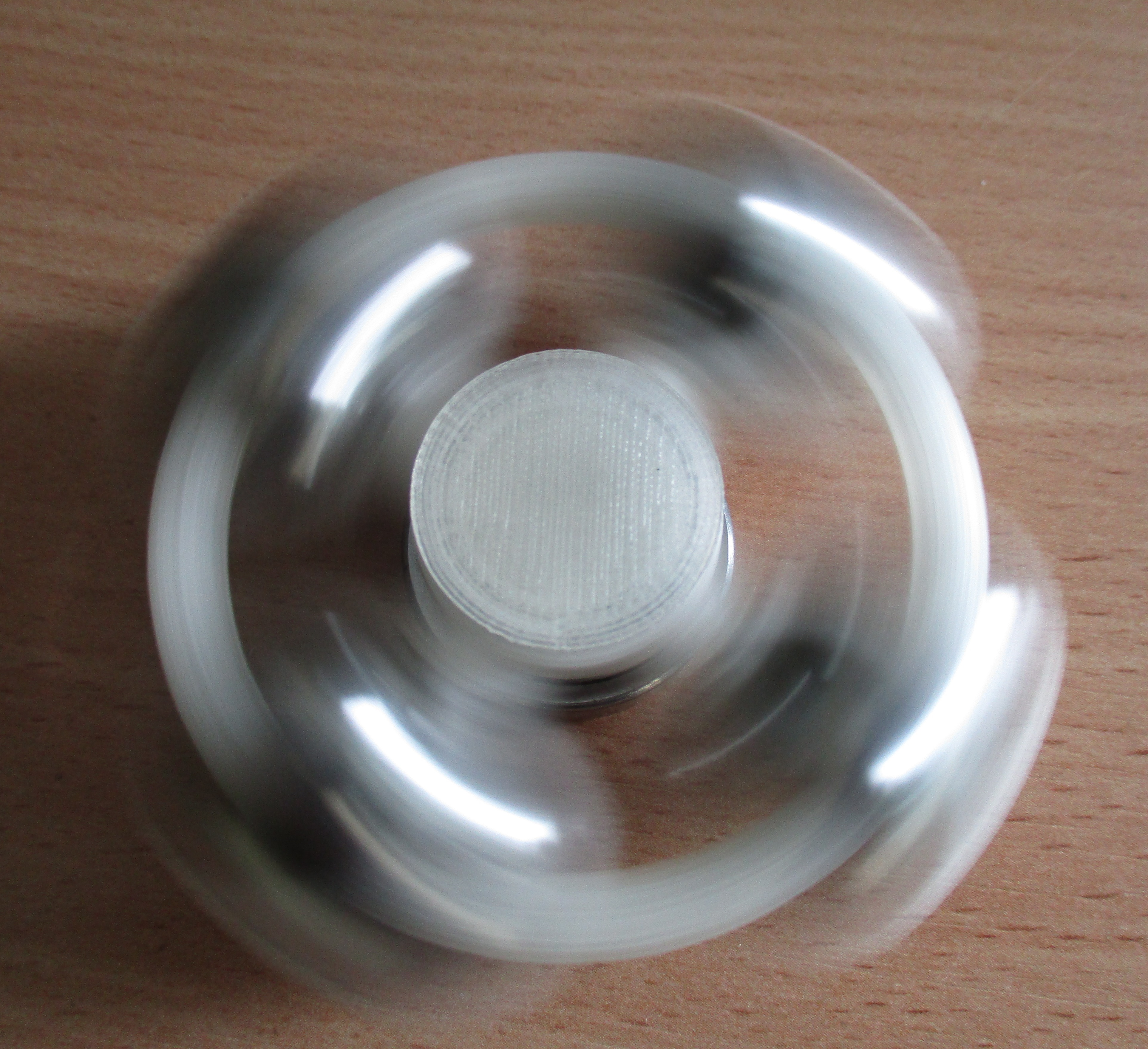 Fidget spinner with balls