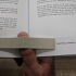 One hand book holder print image