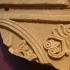 Slab fragment with a palmette relief image