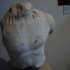 Fragment of a kouros' upper body image
