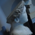 Head and part of the chest of a female statue, possibly an acrolith* image