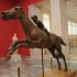 Bronze statue of a horse and young jockey image
