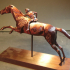 Bronze statue of a horse and young jockey print image