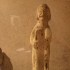 Limestone figure of an old man and boy and Stone figure of old man holding a serpent staff image
