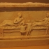 Votive relief depicting a symposium image