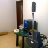 Acoustic guitar with AROMA AG-03M amplifier image