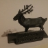 Reindeer with stand and sign image