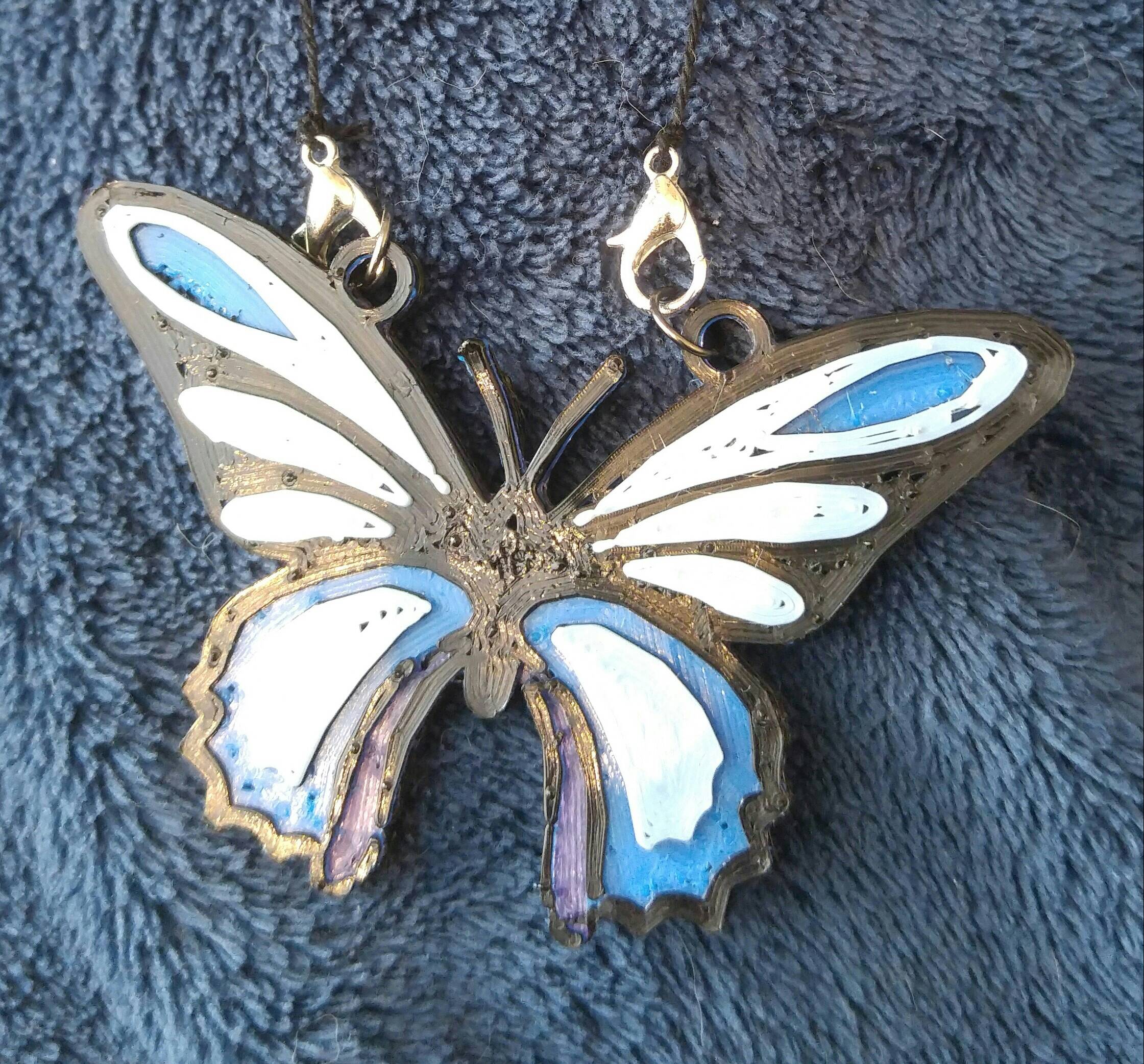 papillon bleu collier
