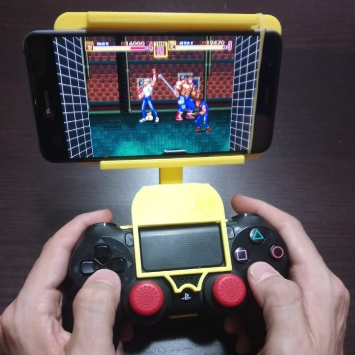 3D Printable phone grip with ps4 dualshock/soporte móvil mando ps4 by  caractermaker