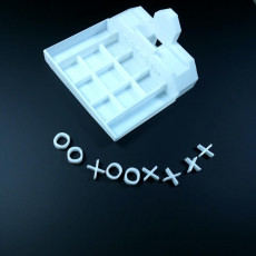 Picture of print of tick tack toe bord / phone charging stand