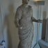 Statue of a woman with a Patera image