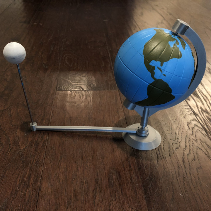 Globe model with stand and orbiting Moon