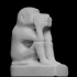 Figure of a squatting monkey image